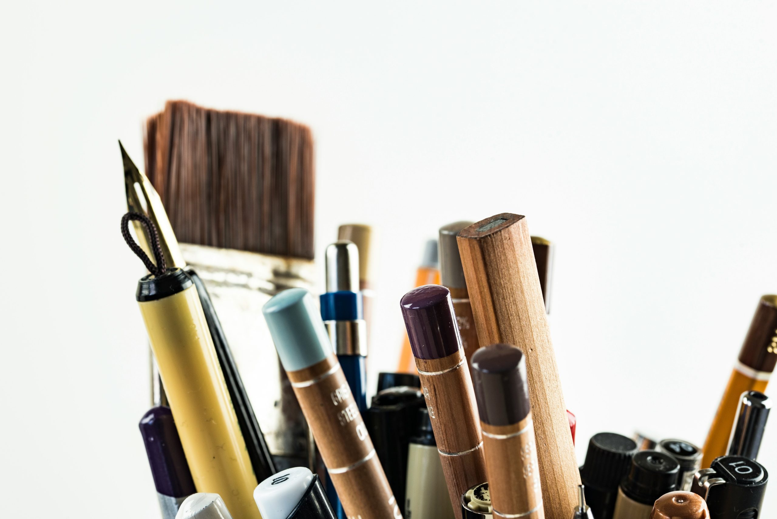 A collection of professional-grade makeup tools including brushes, sponges, and palettes