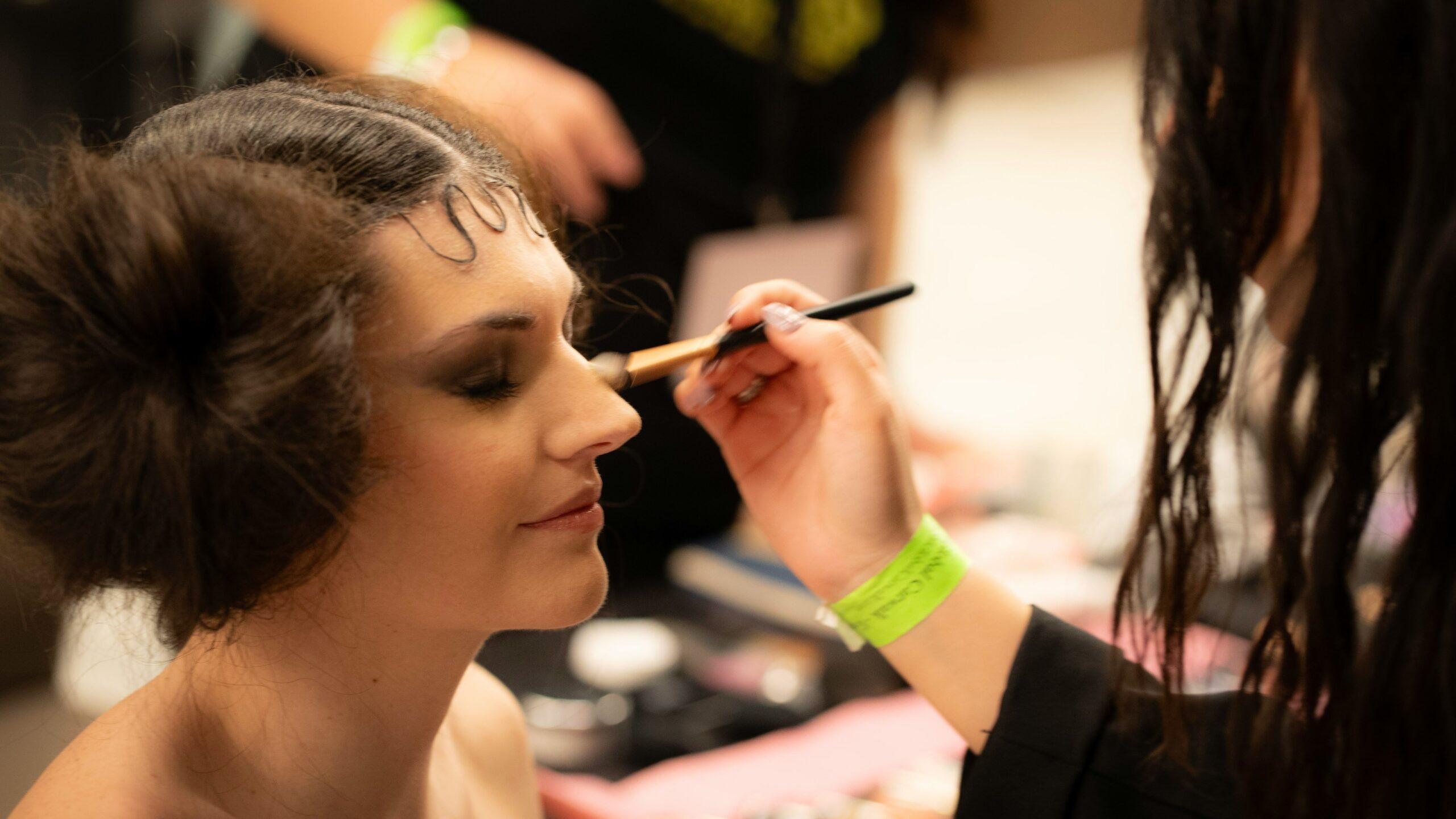 A model wearing heavy base makeup with distinct contours