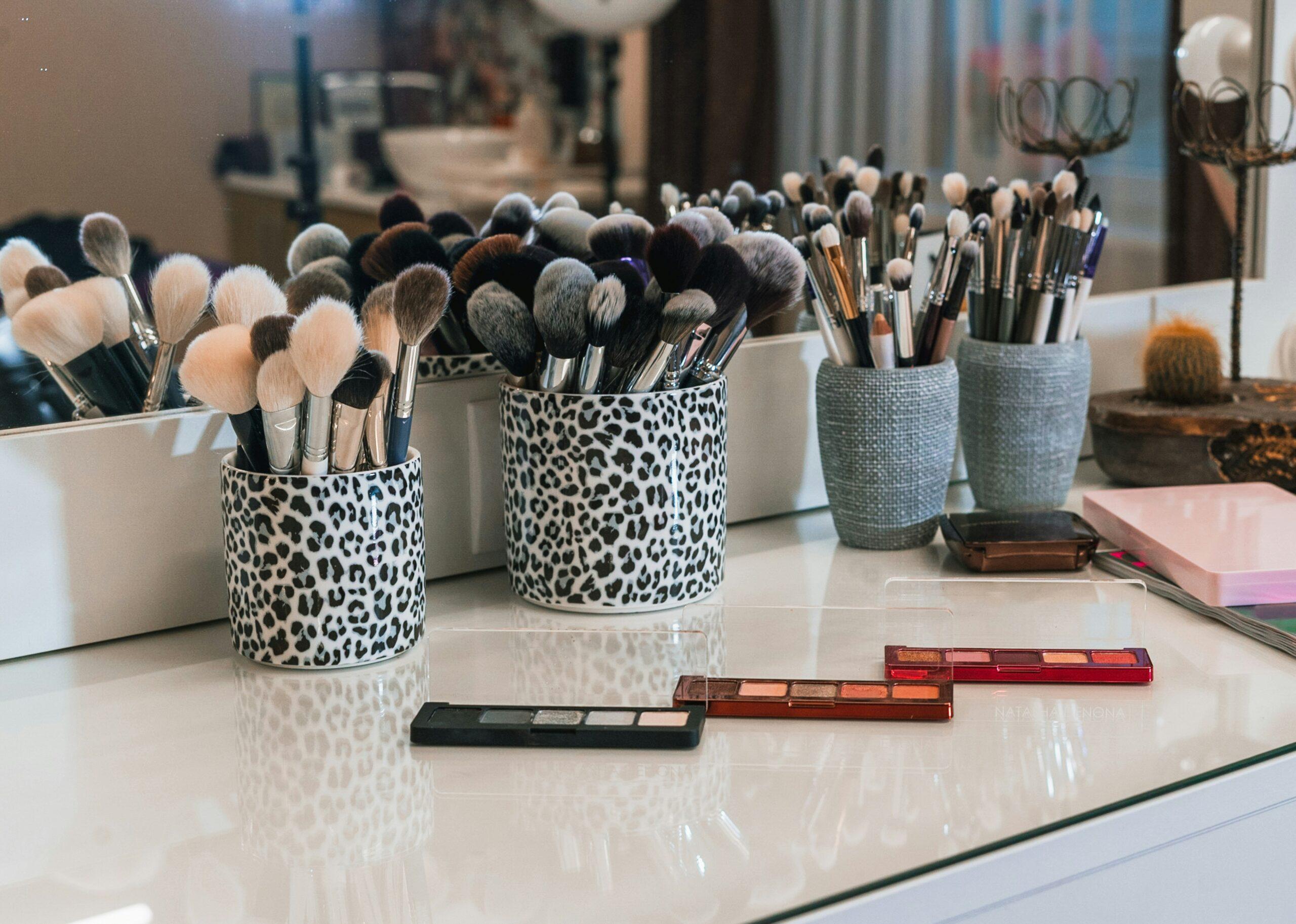 Close-up of high-quality makeup brushes on a white background