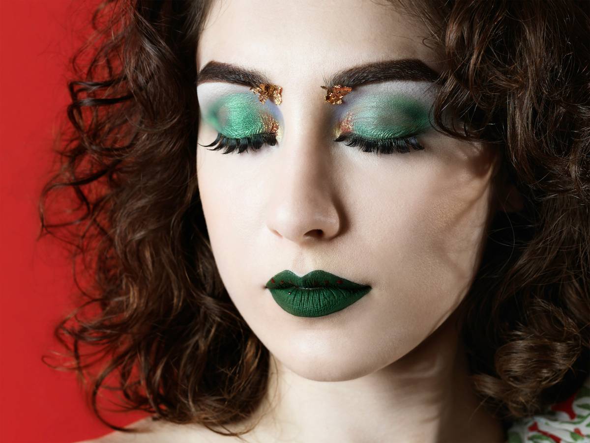 A before-and-after image showcasing a dramatic makeup transformation using artistic techniques.